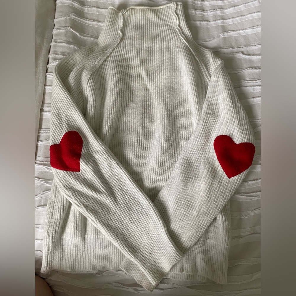 White sweater with heart elbow patches